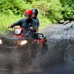 ATV riders plow through New River mud