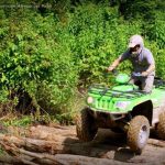 ATV drives across logs at Burning Rock Outdoor Adventure Park, Sophia, WV, Hatfield & McCoy Region