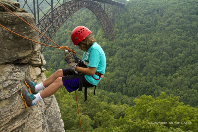 Young climber at New River Gorge Young climber at New River Gorge, New River Gorge National River, Adventures on the Gorge