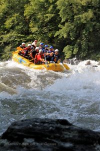Paddling into a Gauley River rapid, Adventures on the Gorge