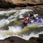 Rafters barrel into a Gauley River rapid