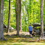 Hiker wanders among rocks near River Expeditions, Fayetteville, New River Gorge Region