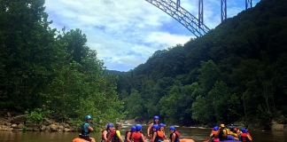 Rafts gather beneath the New River Gorge Bridge