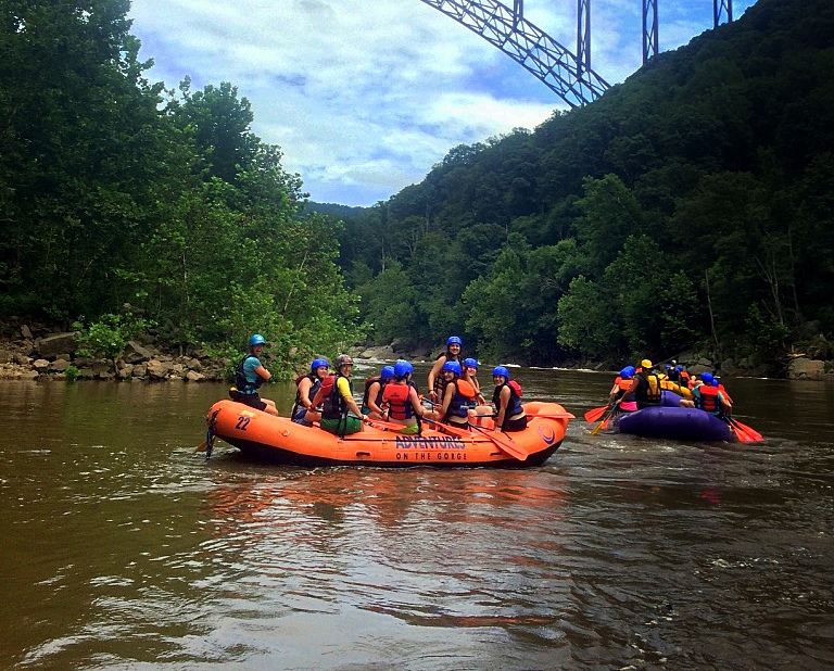 Rafts gather beneath the New River Gorge Bridge