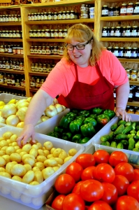 Grocer Joyce Brenemen stocks fresh veggies