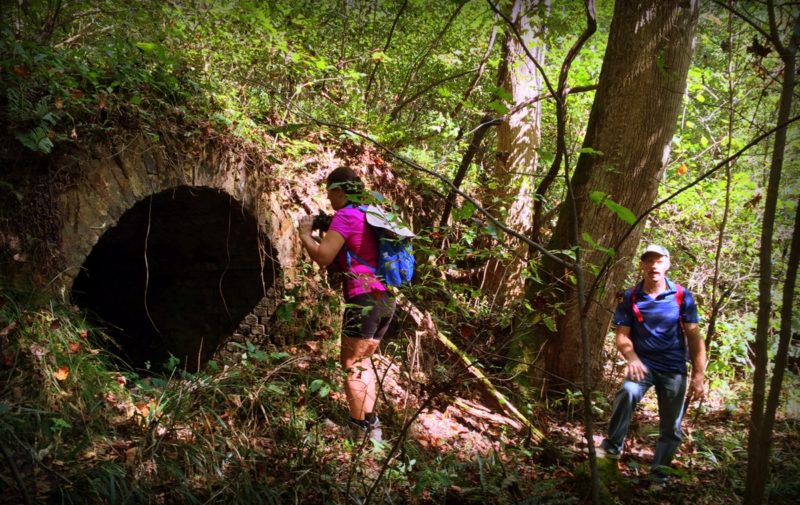 Hikers peer into a coke oven on New River