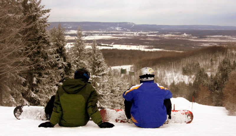 Snowboarders overlook the Canaan Valley from Canaan Valley Resort.