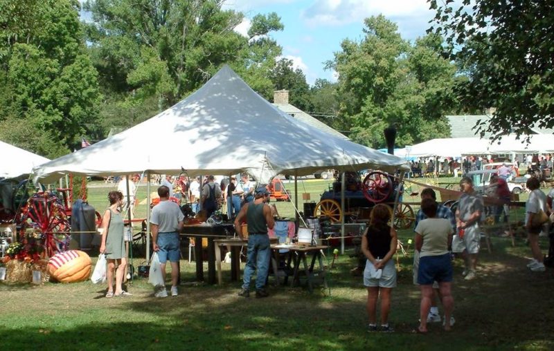 Visitors to the Jackson's Mill Jubilee wander among exhibits on the historic Jackson's Mill festival ground.