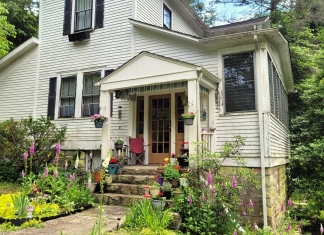 Flowers grow in profusion around the Garvey House at Winona, West Virginia, in the New River Gorge.