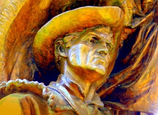 A statue of the Mountaneer stands at the West Virginia Capitol.