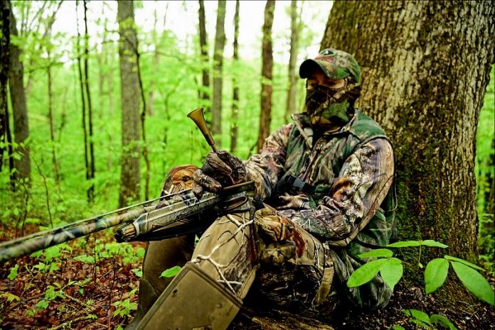 Turkey Hunting in Spring A hunter calls a gobbler during spring turkey season in West Virginia.