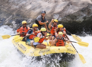 Excited rafters plunge into a rapid on New River.