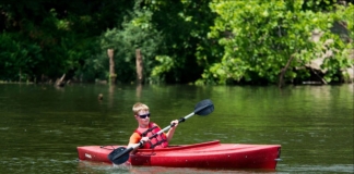 A youth canoes at Beech Fork State Park.