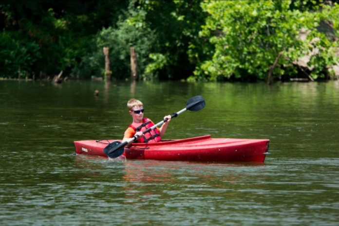 A youth canoes at Beech Fork State Park A youth canoes at Beech Fork State Park.