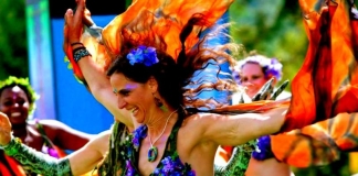 A dancer springs through a crowd at Culturefest, celebrated annually near Pipestem, West Virginia.