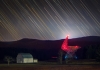 The Byrd Telescope glows red in the darkness at Green Bank.