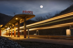 The full moon rises above the passenger station at Prince.