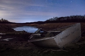 An abandoned boat lies stranded during a drawdown at Summersville Lake.