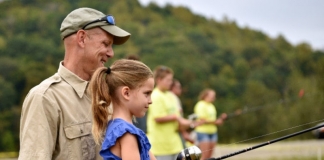 A youth learns to cast at Stonewall Resort State Park. Photo courtesy W.Va. Dept. of Commerce.