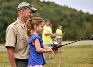 A youth learns to cast at Stonewall Resort State Park. Photo courtesy W.Va. Dept. of Commerce.