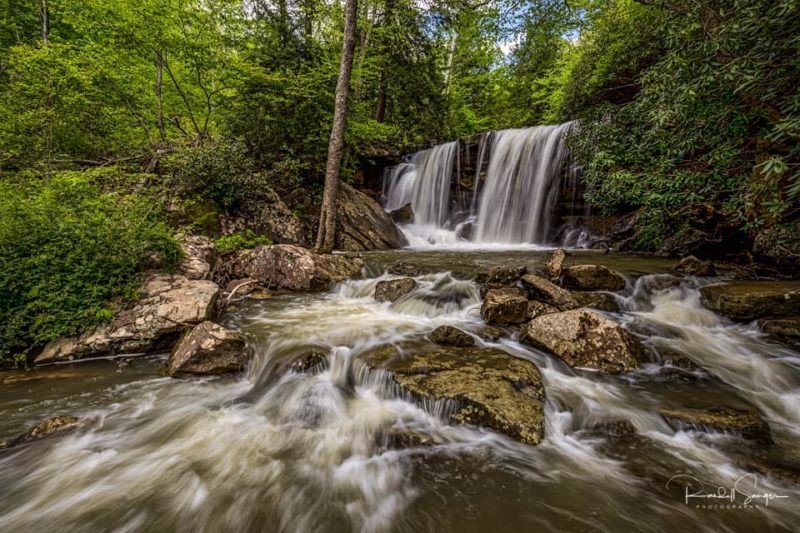 Glady Fork plunges over twin waterfalls at Valley Falls State Park, captured by Randall Sanger.