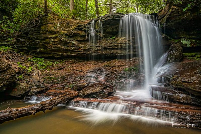 The upper falls of Hills Creek tumbles over a cliff and into the ravine through which two other falls descend.