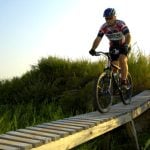 A cyclist crosses at bridge at Mountwood Park near Parkersburg, West Virginia.