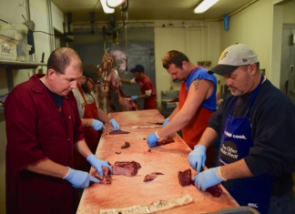 Volunteers prepare deer meat to be distributed to West Virginians in need through the Hunters Helping the Hungry program. Photo courtesy W.Va. DNR.