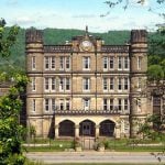 The Gothic Revival facade of the West Virginia Penitentiary dominates Jefferson Avenue in Moundsville. The prison operated from 1866 until 1995 and is now open to visitors as a historic attraction.