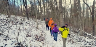 Levi Moore leads a winter hike through the woods in southern West Virginia.