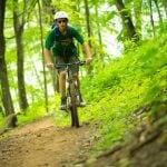 A mountain biker explores trails at the Summit Bechtel Scout Reserve near the New River Gorge.
