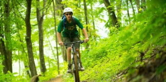 A mountain biker explores trails at the Summit Bechtel Scout Reserve near the New River Gorge.