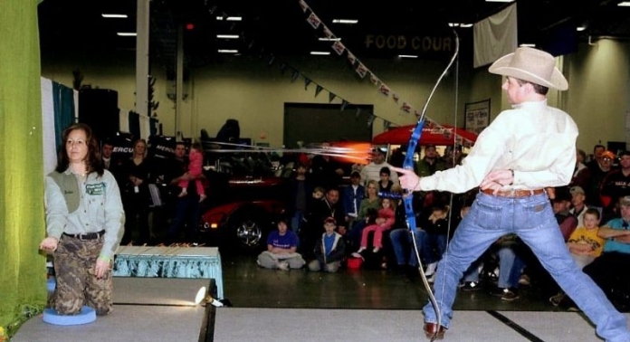 Addington aims at aspirin Frank Addington, Jr., takes aim at aspirin at the W.Va. Hunting and Fishing Show.