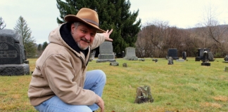 David Sibray points toward the possible site of a prehistoric ruin in the old Mount Hope Cemetery.