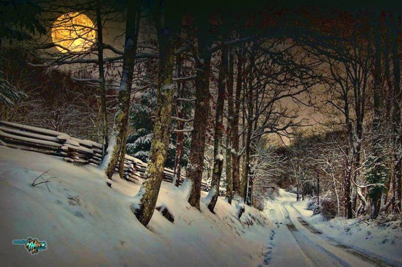 A snow moon rises along a country road in West Virginia. Photo courtesy Chuck Reed of Emerging Aire PhotoGrafix.