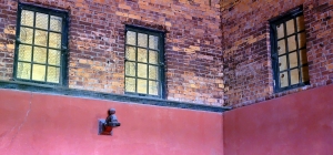 Metal windows and sconces highlight the interior of the Raleigh Powerhouse.