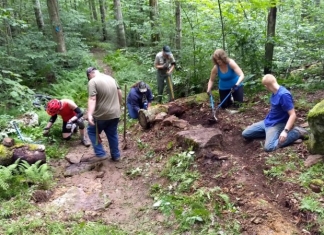 Volunteers with the New River Gorge Trail Alliance repair trail in the Monongahela National Forest with forest service staff and Youth Conservation Corp members.