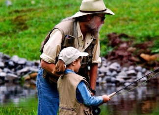 A father and daughter enjoy family fishing trip in West Virginia. Photo courtesy W.Va. Dept. of Commerce.