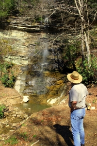 David Sibray visits a waterfall along the Buffalo Creek and Gauley Railroad during an excursion.