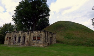The Grave Creek Mound rises behind an early visitor center. Photo courtesy Charity Moore.