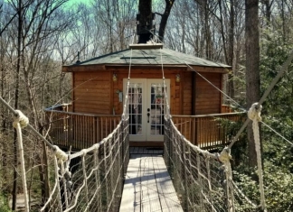 A suspended bridge leads to the Holly Rock Treehouse.