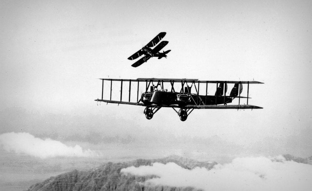 Martin MB-2 in flight with a pursuit aircraft practicing an attack. (U.S. Air Force photo)