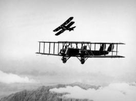 Martin MB-2 in flight with a pursuit aircraft practicing an attack. (U.S. Air Force photo)