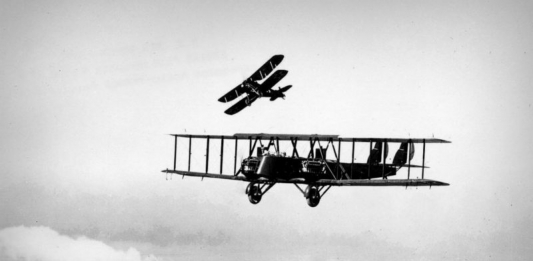 Martin MB-2 in flight with a pursuit aircraft practicing an attack. (U.S. Air Force photo)