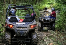ATVers navigate a muddy trail near the New River Gorge. Photo courtesy New River ATV Tours.