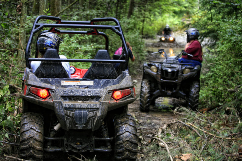 ATVers navigate a muddy trail near the New River Gorge. Photo courtesy New River ATV Tours.