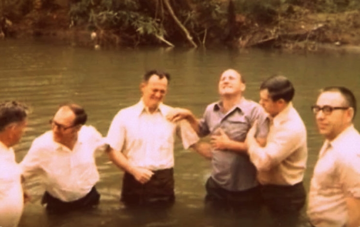 The father of Shirley Stewart Burns is baptized in southern West Virginia.