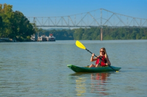 A kayaker plies the gentle Ohio River near Parkersburg, West Virginia, once the site of the infamous Graveyard of the Ohio.