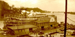 Waterfront scene showing Parkersburg wharf boat and Louisville & Cincinnati Packet Co. boat at Parkersburg, West Virginia, circa 1925.