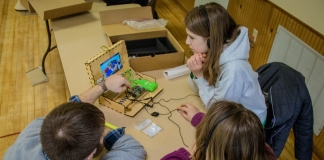 Students learn programming in the classroom through WVU extension programs.